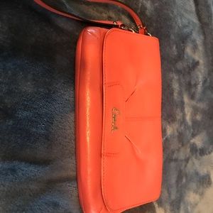 Coach leather wristlet in peach